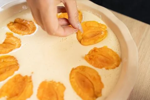 Close-up of Chef puts apricots in pie to bake in the oven Stock Photos