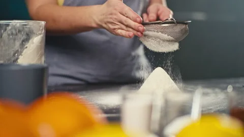 Close-up of chef sifting flour in kitchen Stock Footage 236773388