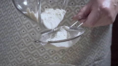 Close-up Chef sifting flour to prepare bread dough. Selective focus. Stock Footage 301230184
