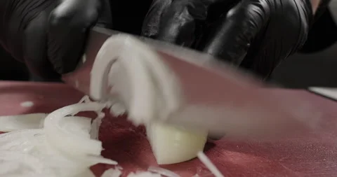 Close-up chef slice onion on the cutting board. Male hands cut vegetables Stock Footage 274180384