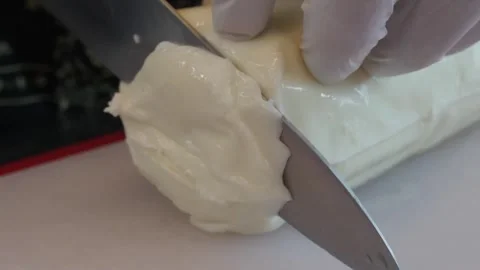 Close-up of Chef Slicing Fresh Mozzarella Filone Cheese for Authentic Italian Pi Stock Footage 337676574