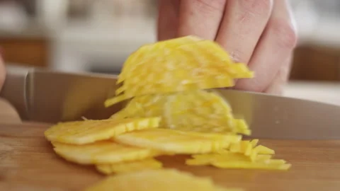 Close up of chef slicing vibrant yellow beet for a salad Video stock 153290238