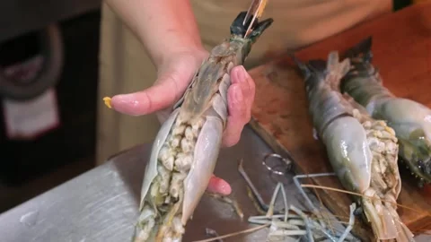 Close-Up of Chef Splitting Fresh Giant Prawn with Kitchen Scissors Stock Footage 344216930