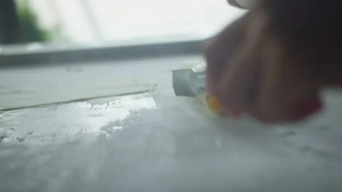 Close up of chef spreading mango ice cream on a frozen pan and carefully rolling Vidéo 340088606