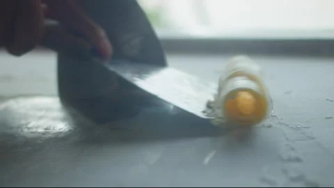 Close up of chef spreading mango ice cream on a frozen pan and carefully rolling Stock Footage 344818454