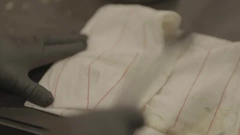 Close-up of chef tapping food through cloth Vidéo 336374453