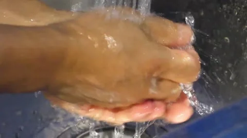 Close-up of Chef Washing Hands Under Running Water in Kitchen Sink for Food Safe Stock Footage 337676673
