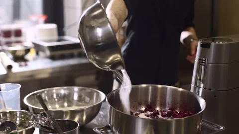 Close up. A chef weighs cherries for baking a fruit pie or other desserts. Stock Footage 233296794