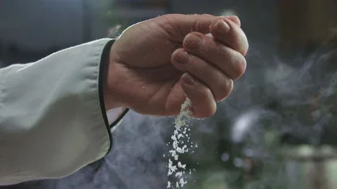 Close-up of the chef's hand adding salt to the dish Stock Footage 158866835