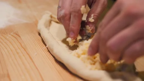 Close-up, the chef's hands are preparing traditional khachapuri in Ajarian Stock Footage 170755176