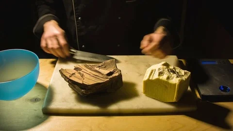 Close-up chefs hands chopping butter 動画素材 79779594