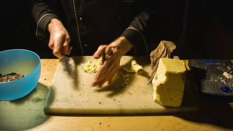 Close-up chefs hands chopping butter 스톡 동영상 79810052