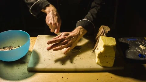 Close-up chefs hands chopping butter 動画素材 79812552