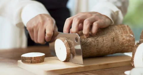 Close up of chef's hands chopping tapioca on cutting board in the kitchen 動画素材 204843692