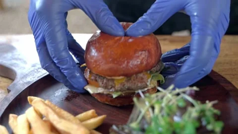 Close-up of a chef's hands preparing an appetizing meat hamburger. Stock Footage 228684976