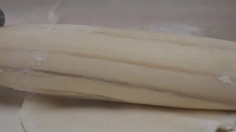 Close-up of chef's hands rolling out small circles with rolling pin. Stock Footage 314241918