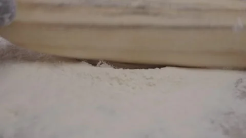 Close-up of chef's hands rolling out small circles with rolling pin. Stock Footage 314971407