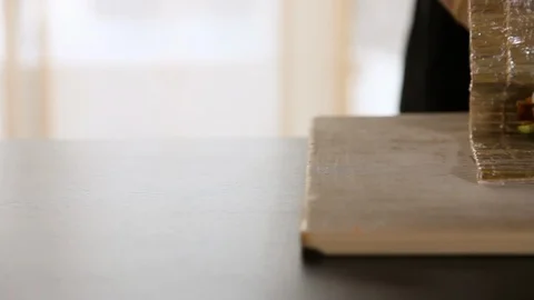 Close-up of chef's hands rolling a sushi roll on bamboo mat.Sushi making process Stock Footage 119558241