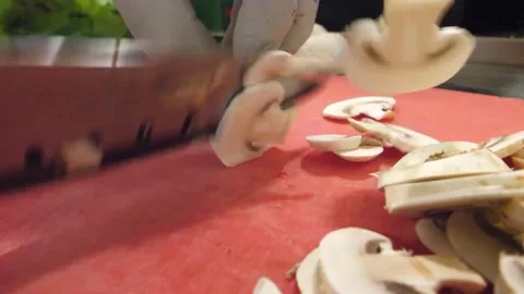 Close-up of Chef's Hands Slicing Fresh Champignon Mushrooms for Italian Pizza Stock Footage 337678837