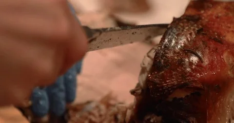 Close Up of Chef's Knife Cutting into a Steaming Turkey Stock Footage 83487150