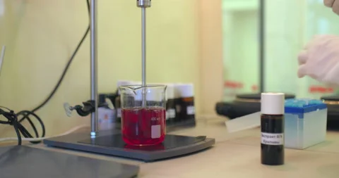 Close-up, a chemical solution is mixed with special equipment in a beaker in a Stock Footage 146468039