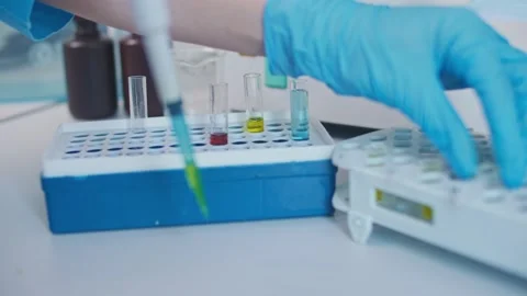 Close-up Chemist Mixed up Chemicals Using a Micropipette. Developers of Stock Footage 144674884