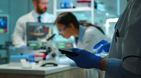 Close up of chemist nurse using tablet Stock Photos