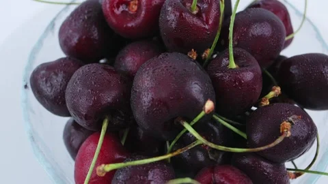 Close-up of cherry rotating in bowl. Delicious, summer fruit, organic cherries 動画素材 342964206