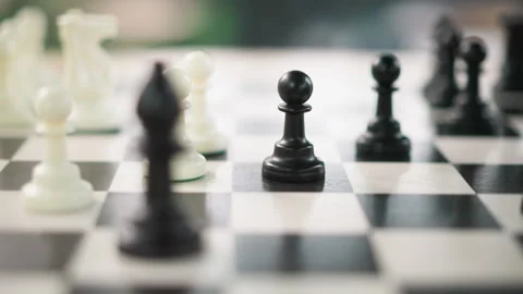Close up of chess pieces on checkered board with shallow depth of field and Stock-Footage 346650256