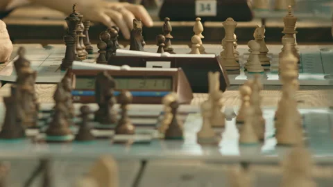 Close-up of a chess tournament with a clock on a summer day in the park Stock Footage 159871301