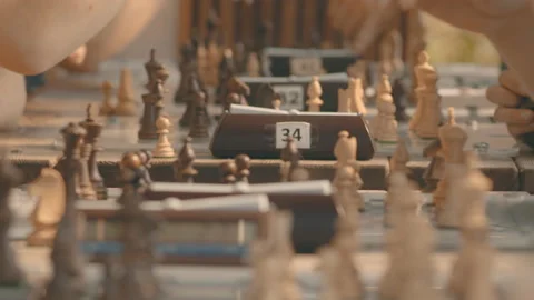 Close-up of a chess tournament with a clock on a summer day in the park Stock Footage 160091982