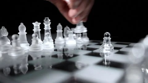 Close-up of chessboard with glass figures during game Stock Footage 237440608