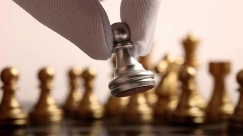 Close up chesses strategy concept of silver and gold chess on classic board. Stock Photos