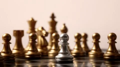 Close up chesses strategy concept of silver and gold chess on classic board. Stock Photos