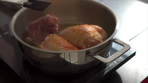 Close-up of chicken being cooked until browned Stock Footage 318850641