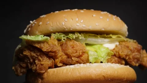 Close up of a chicken burger rotating Stock Footage 160557933