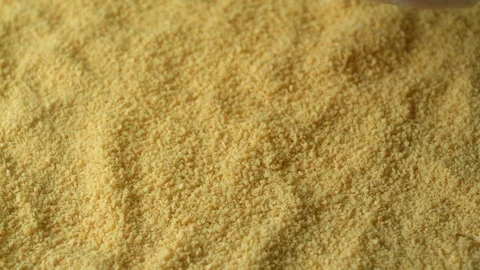 Close-up of chicken fillet falling into a breadcrumbs for frying in a pan Stock Footage 116878295