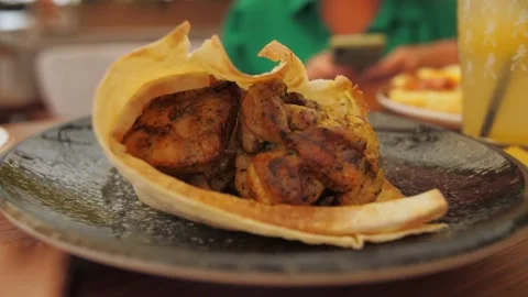 Close up Chicken kebab in pita bread food in restaurant.Food on table in the Stock Footage 203508960