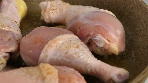 Close-up of chicken legs fried in a pan Stock Footage 134684752