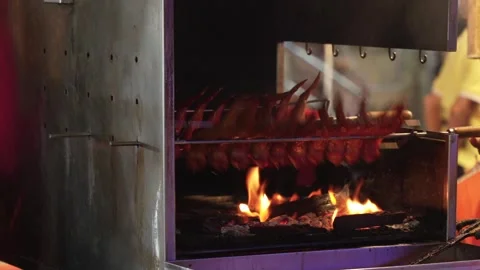 Close up of chicken wings BBQ rotate on Rotisserie Grill Over Open Flame. Asian 動画素材 341780299
