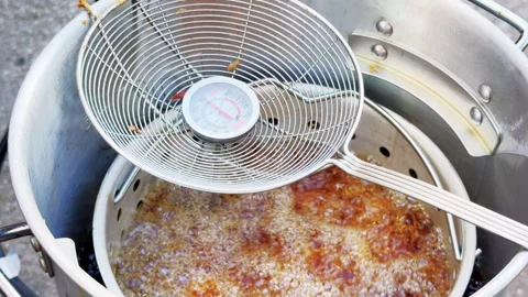 Close Up Chicken Wings Frying Beneath Wire Skimmer Stock Footage 346648916