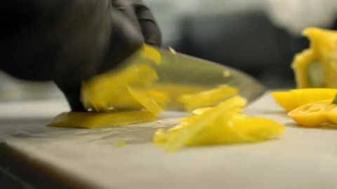 Close up of chief man making salad healthy food and chopping yellow paper Stock Footage 100550428