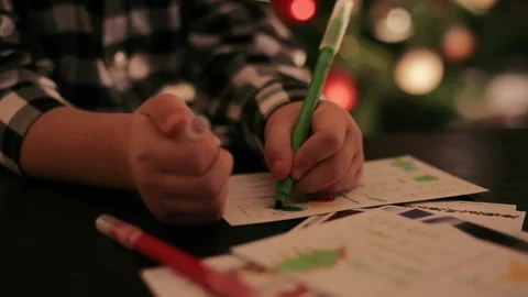 Close Up of Child Boy Writing Letter To Santa Claus At Cozy Home Stock Footage 145335136