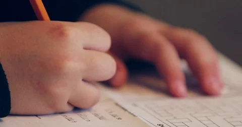 Close up of child doing homework and studying Stock-Footage 72759680