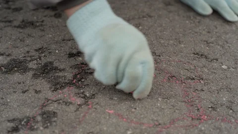 Close up child draws a funny face on the asphalt Stock Footage 127978035