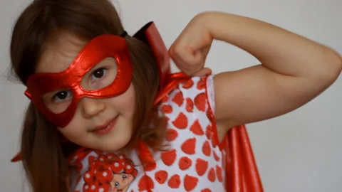 Close up child dressed as a super hero showing strength. Concept of happiness Stock Footage 137008203