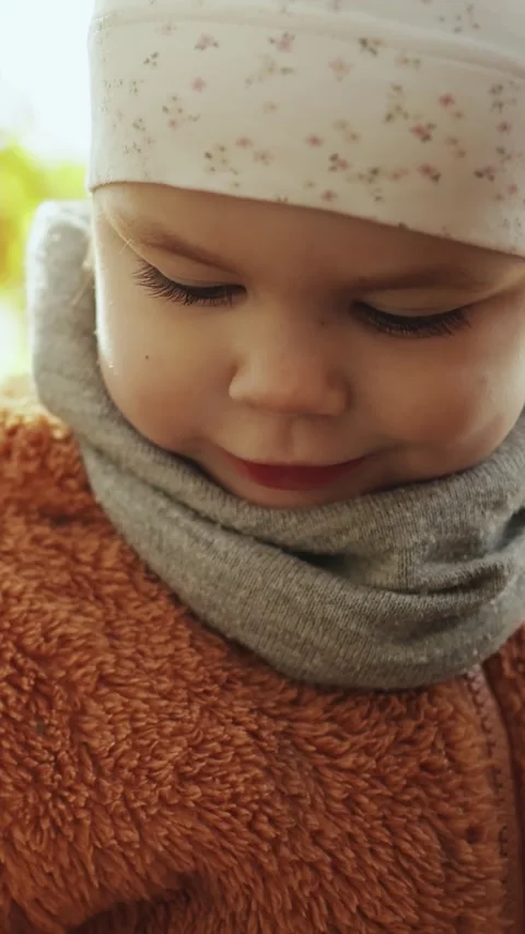 Close-up of a child exploring the autumn forest, portrait of a little girl Stock Footage 307681780