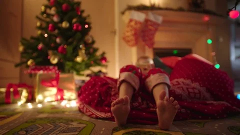 Close up of child feet dancing while waiting for Santa Claus coming on Christmas Video stock 73032875