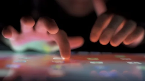 Close up of Child finger touching screen on tablet pc Stock Footage 126979989