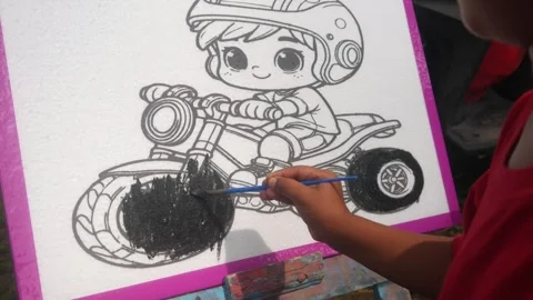 Close up of a child hand coloring a cartoon Stock Footage 321979528